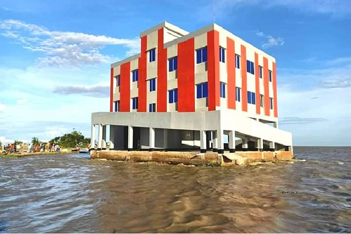 The newly built school cum cyclone shelter is floating in the river